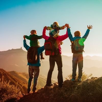 Family hiking at sunrise